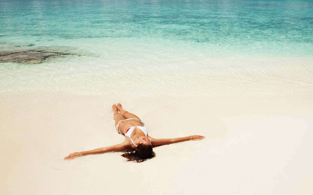Woman Laying on Beach Woman Laying on Beach